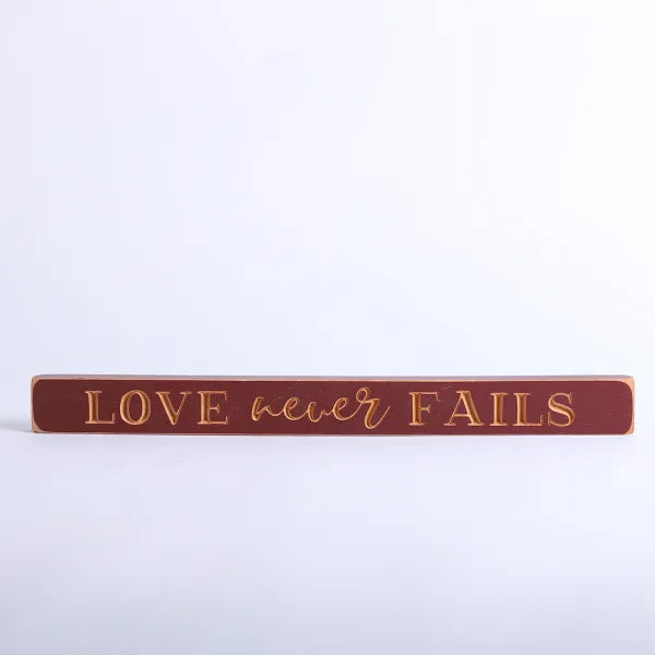 45cm Engraved Wooden Sign: Love Never Fails/Red - The Christian Gift Company
