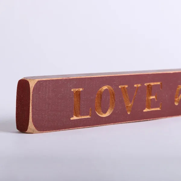 45cm Engraved Wooden Sign: Love Never Fails/Red - The Christian Gift Company
