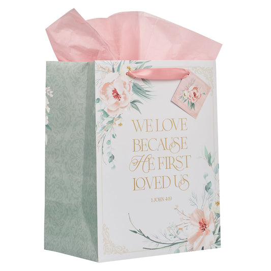 Love Peachy-pink Floral Large Portrait Gift Bag - 1 John 4:19 - The Christian Gift Company